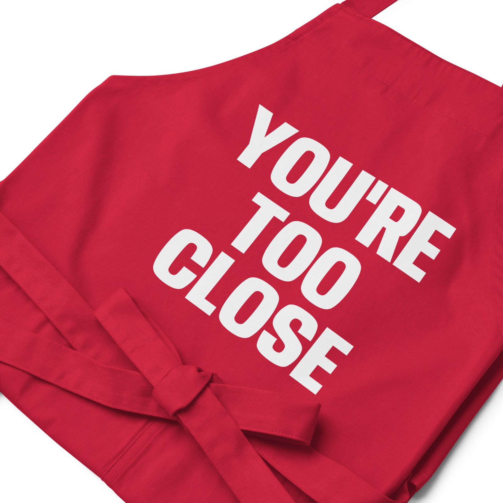 organic-cotton-apron-red-zoomed-in-6624ea2f7edcf.jpg